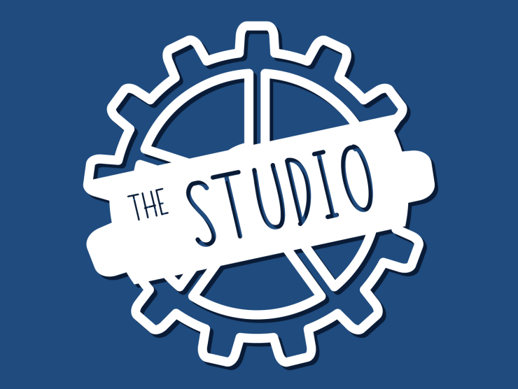 dark blue field with white gear and text that says "the studio"