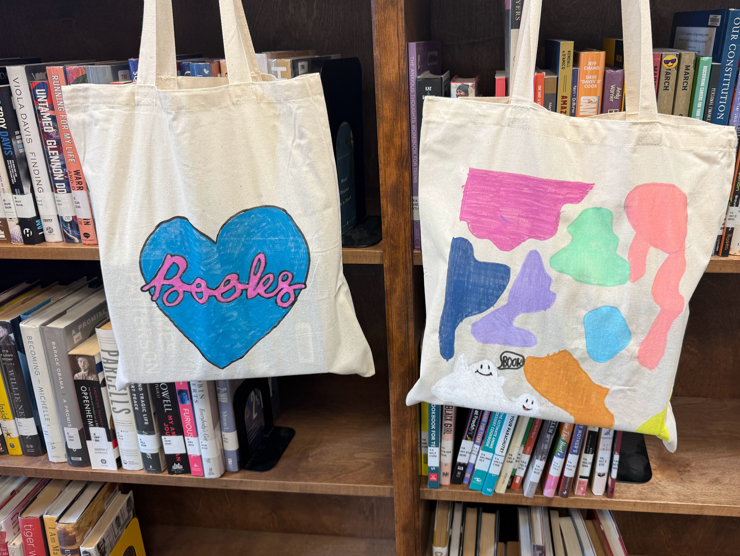 Examples of hand-decorated tote bags