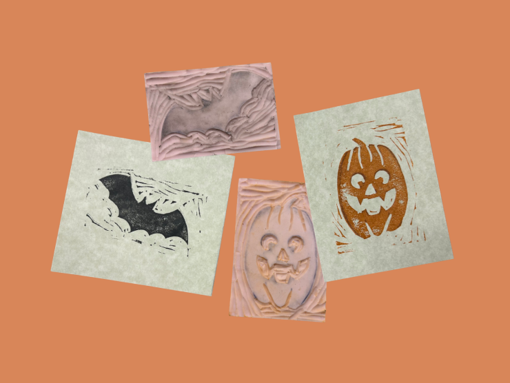 An orange background with two squares of paper and two rubber stamps. One paper shows a black bat, the other an orange jack-o-lantern. The rubber stamps match the pictures on the paper.